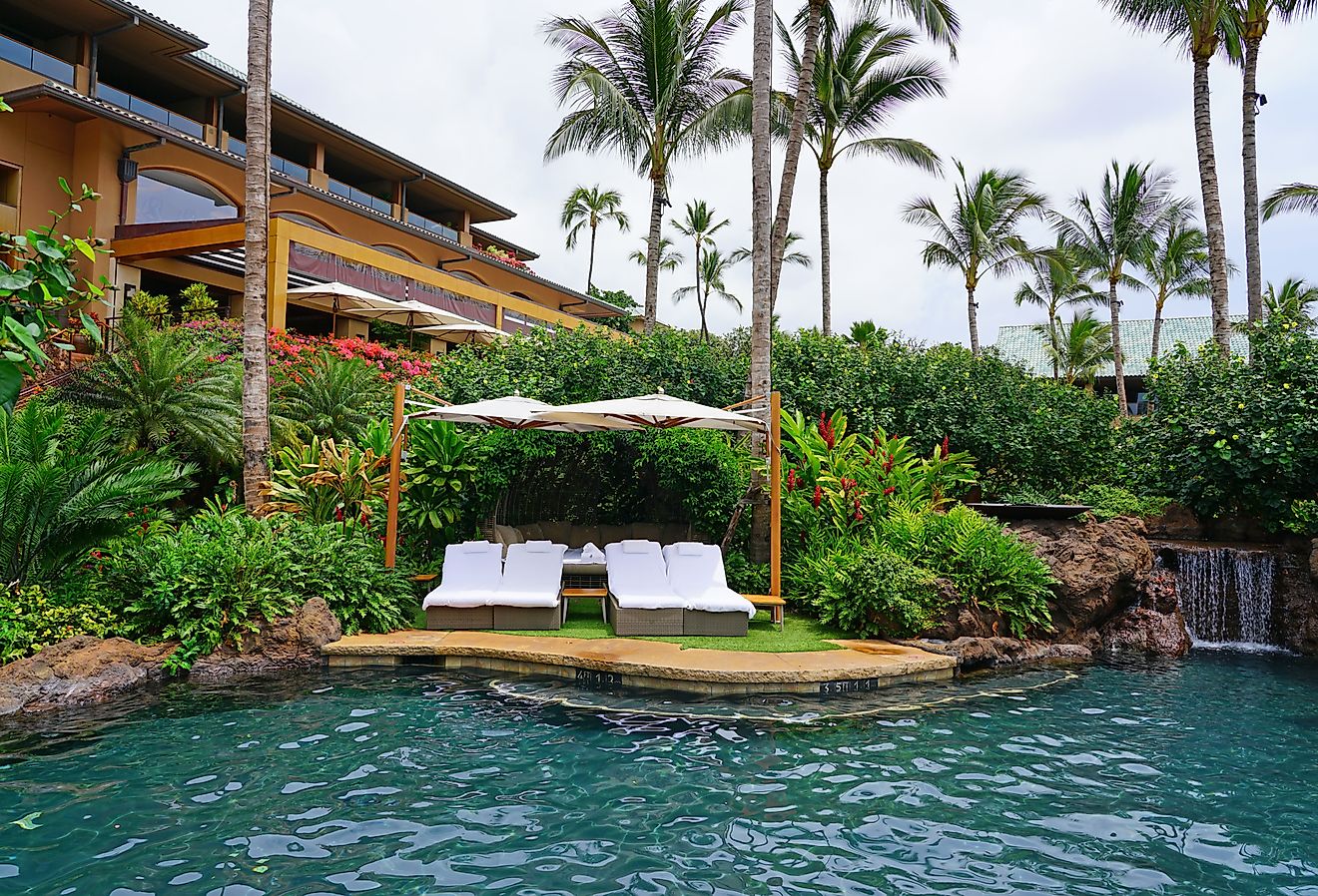 View of the Four Seasons Resort Lanai, an upscale luxury hotel next to Hulopoe Beach on the Pacific Ocean. Image credit EQRoy via Shutterstock.