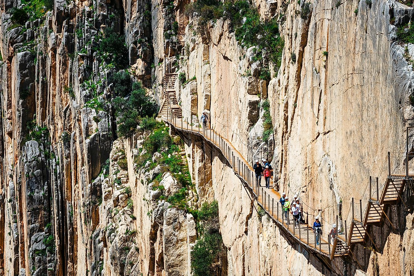 Visitors walking along the World's most dangerous footpath. Editorial credit: Dziewul / Shutterstock.com