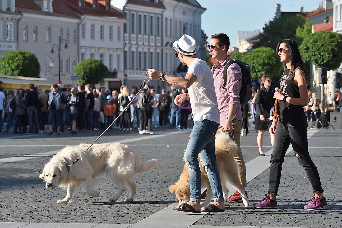People walk down the street in Vilnius, Lithuania. Editorial credit: astudio / Shutterstock.com.