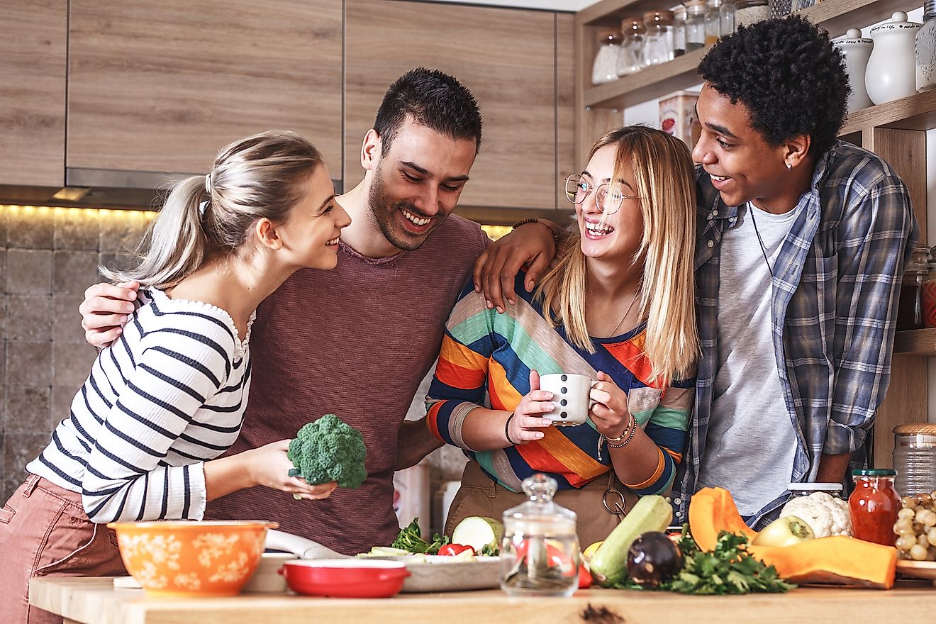 Friends cooking a vegetarian meal. Image credit: Solis Images/Shutterstock.com