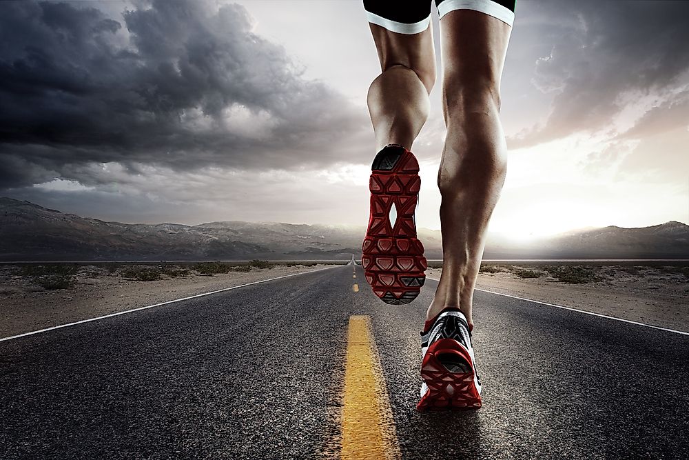 Runner feet running on road