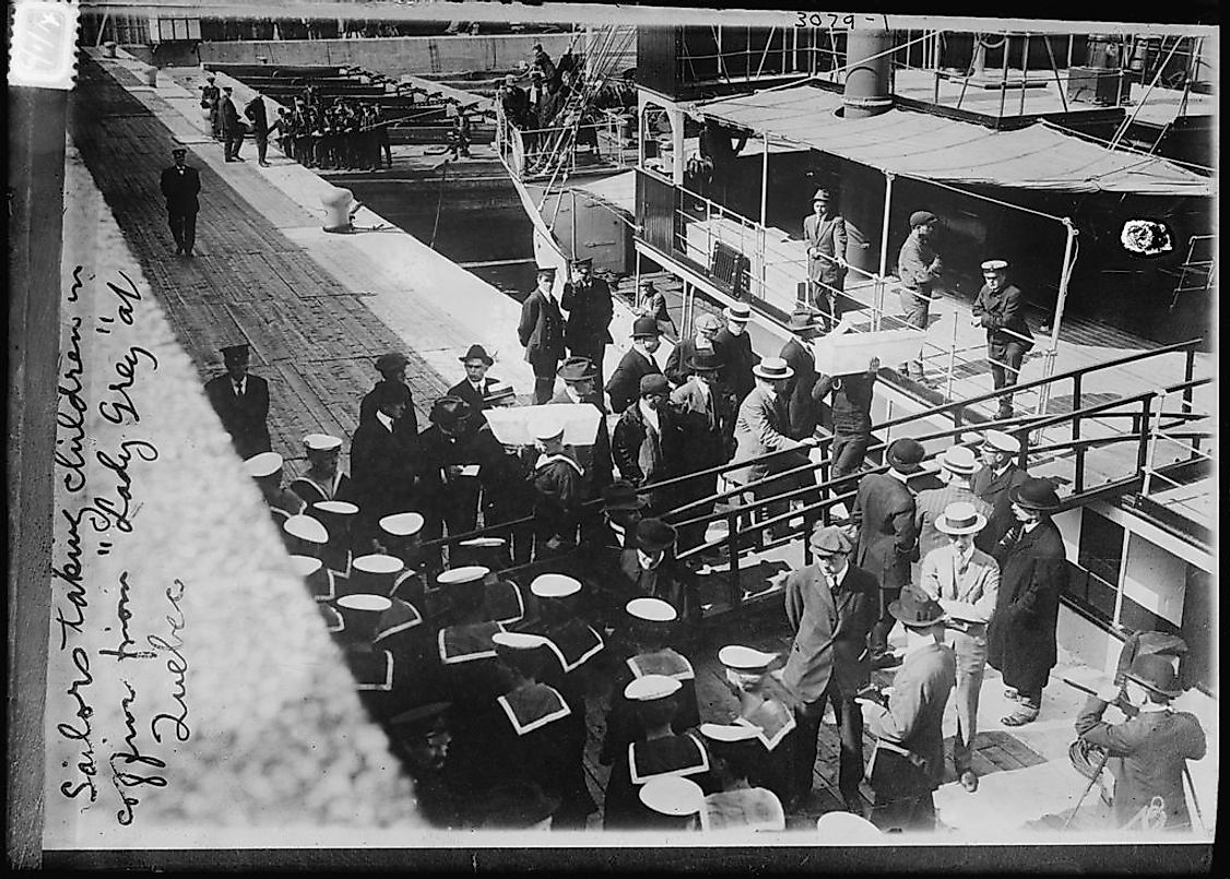 Unloading the coffins of the children from Lady Gray.