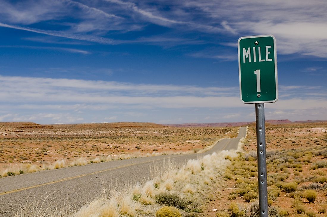 Mileage signs along highways indicate relative locations. 