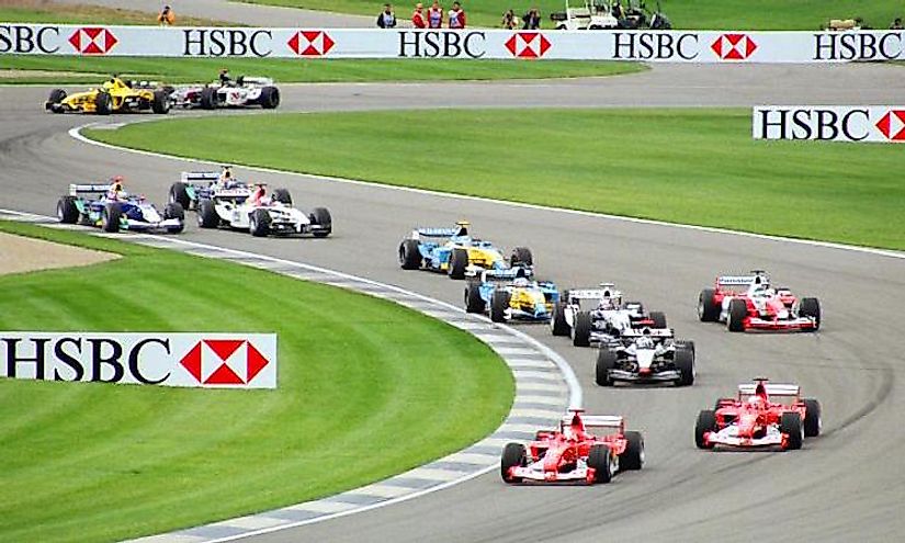 Cars wind through the infield section of the speedway at the 2003 United States Grand Prix.