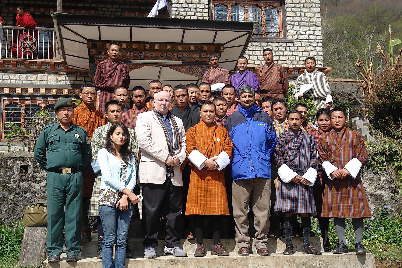 Dr. Phuntsho Thinley (front row center in orange robe) with staff of Jigme Dorji National Park and international wildlife experts.
