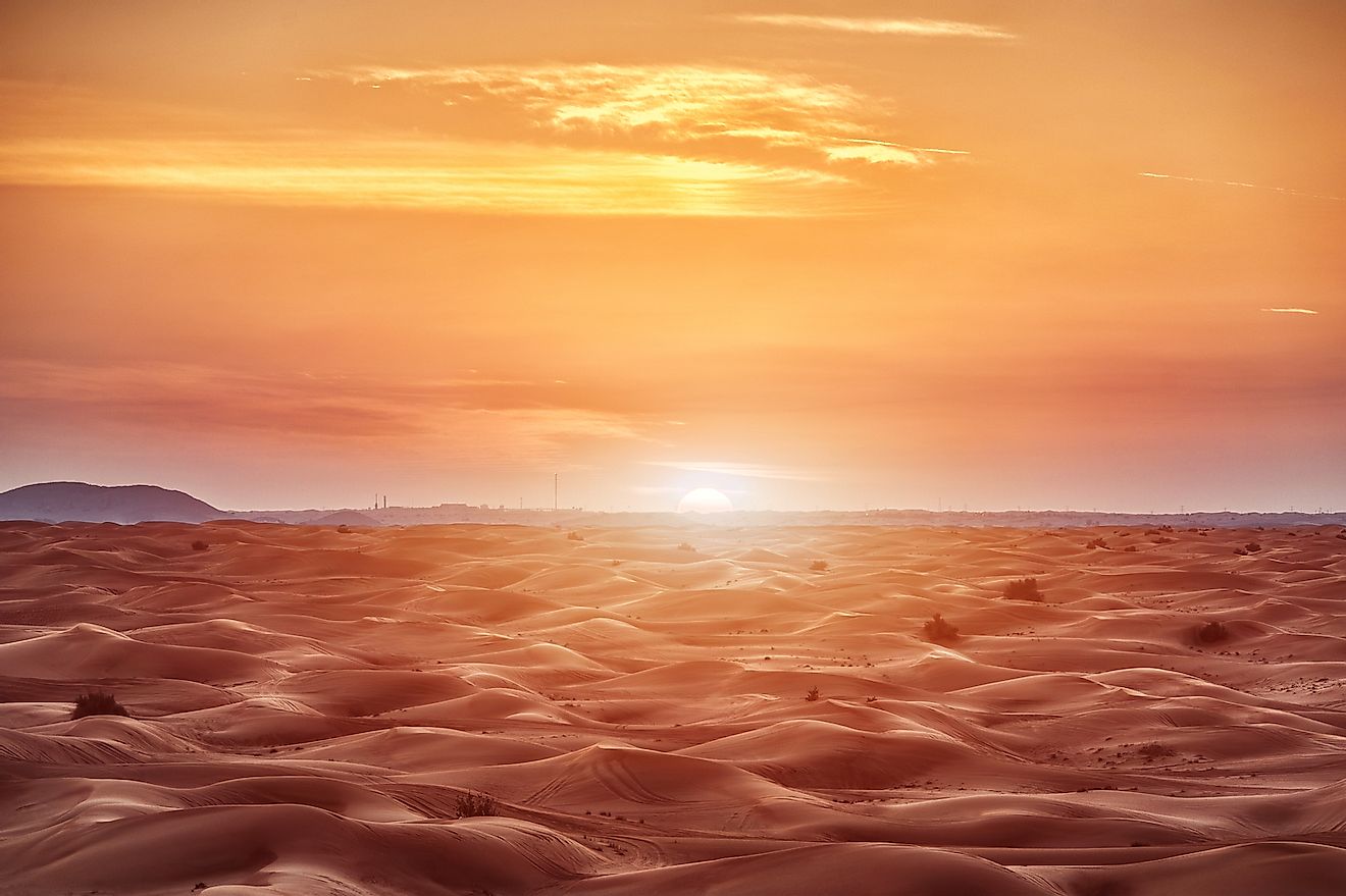 Colorful red sunset over desert. Image credit: Sergii Chernov/Shutterstock.com