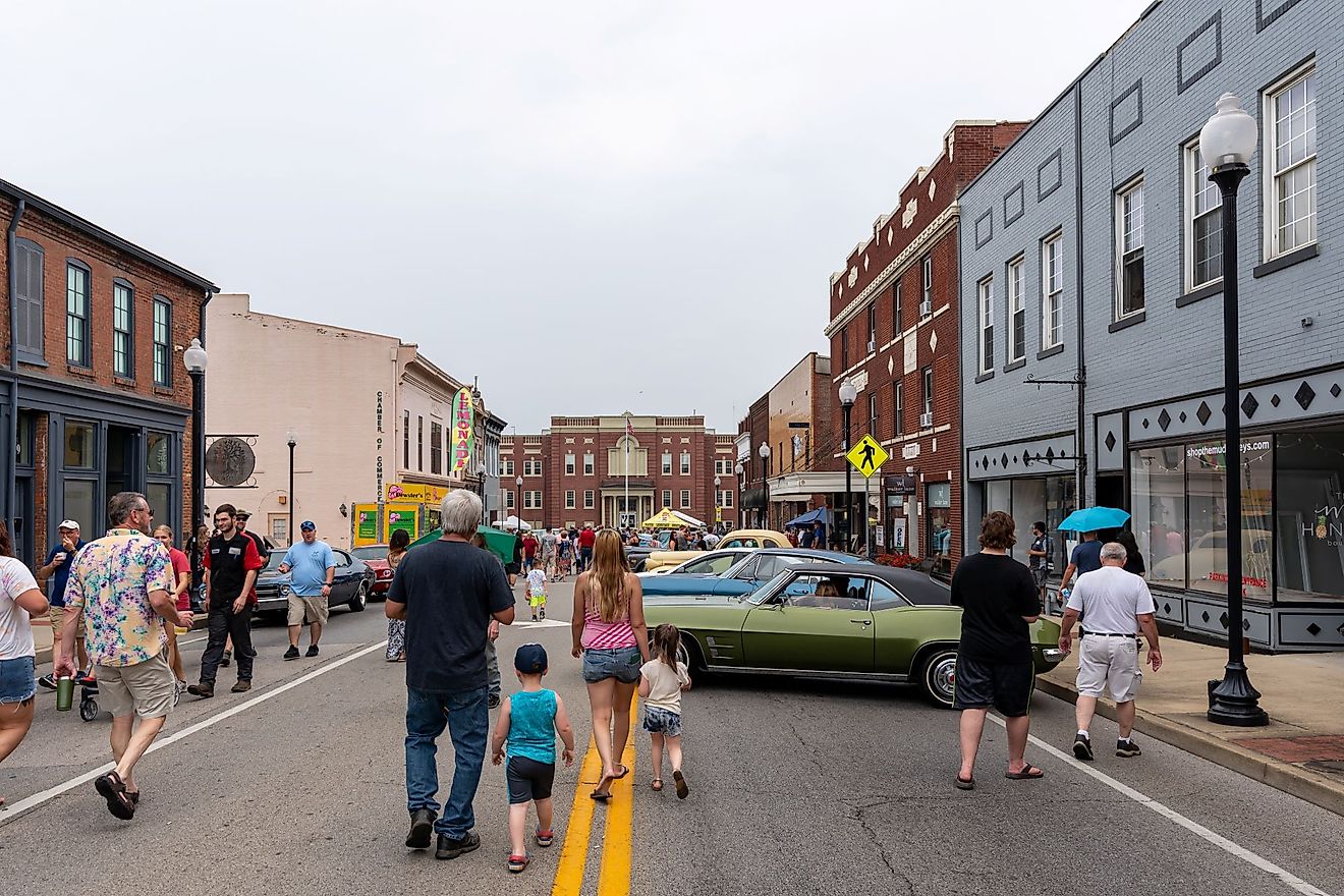Spectators walk in the streets with cars on display during the Cruisin' The Heartland 2021 car show in downtown Elizabethtown, Kentucky. Editorial credit: Brian Koellish / Shutterstock.com