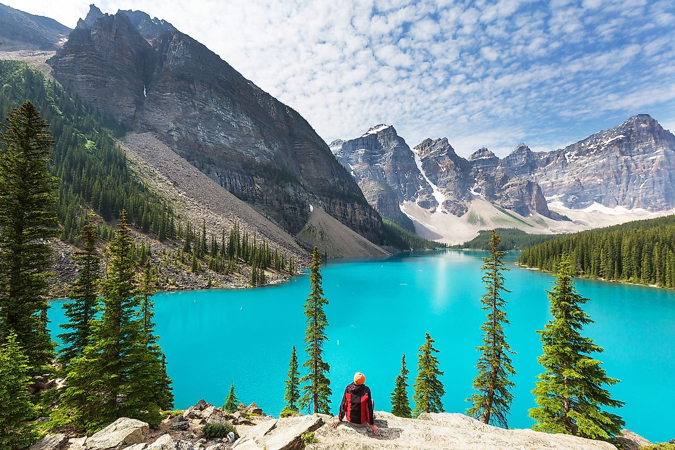 A tourist enjoying the spectacular view of the Moraine Lake.