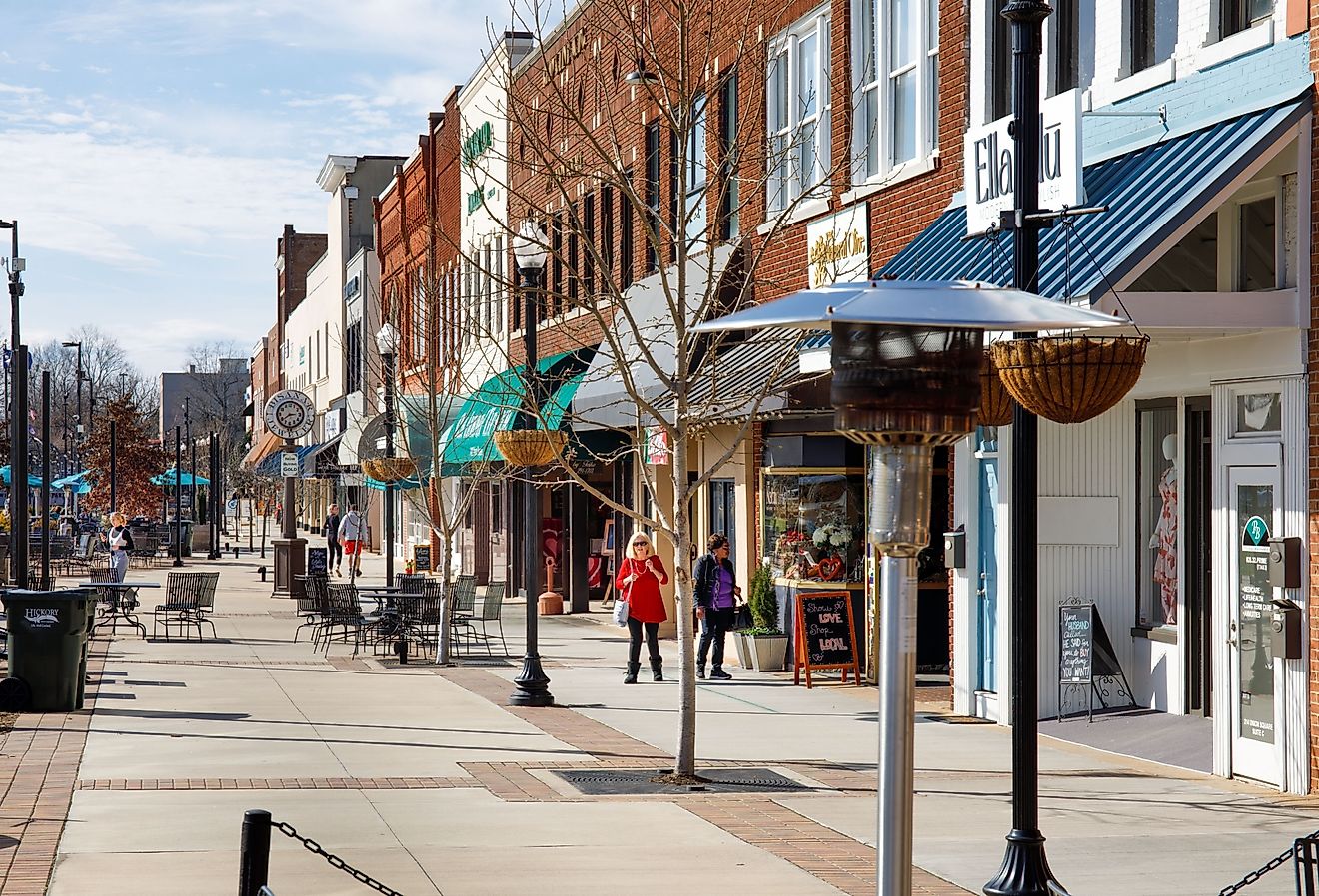  Downtown plaza with outdoor dining, shoppers, storefronts, on sunny winter day in Hickory, NC. Image credit J. Michael Jones via Shutterstock.
