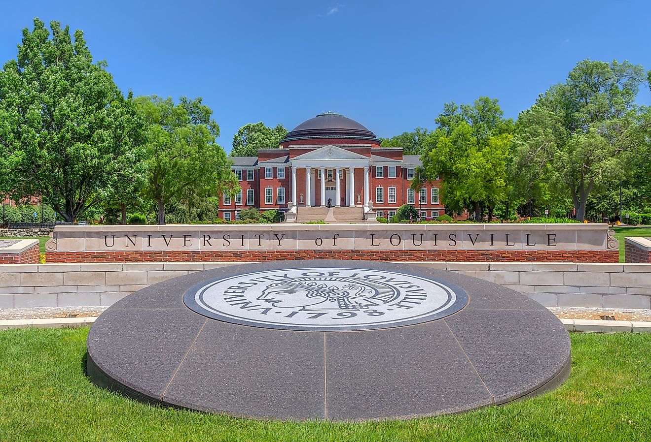 University of Louisville Entrance and logo with campus building. Image credit wolterke via AdobeStock.