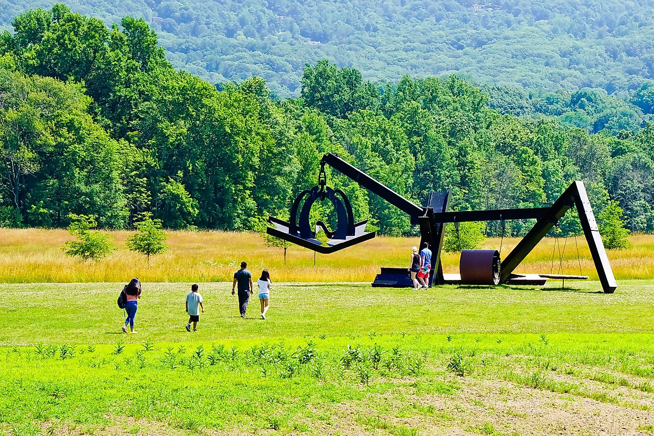 Mountainville, New York/United States-7/7/2019: tourists visiting new addition of sculpture of “she” by Mark DI Suvero in storm king art center. Yingna Cai via Shutterstock