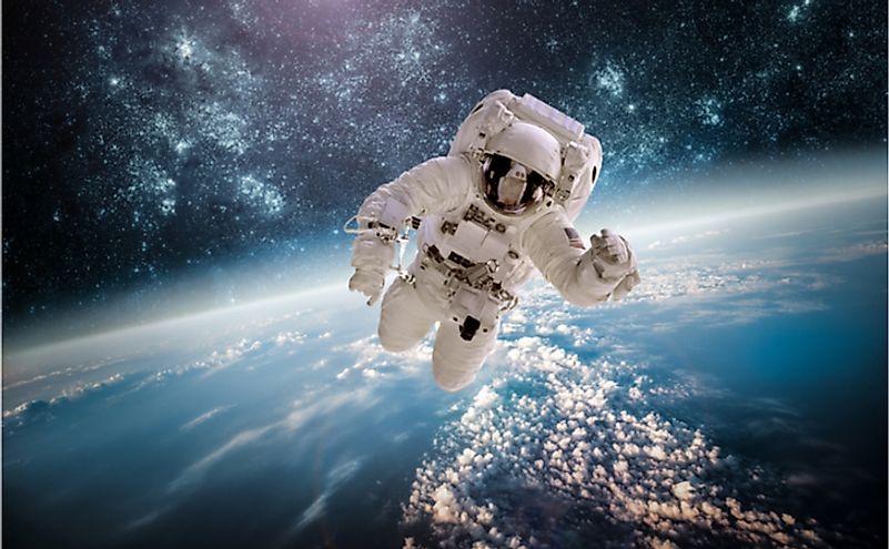 Astronaut in outer space against the backdrop of the planet earth. Elements of this image furnished by NASA.