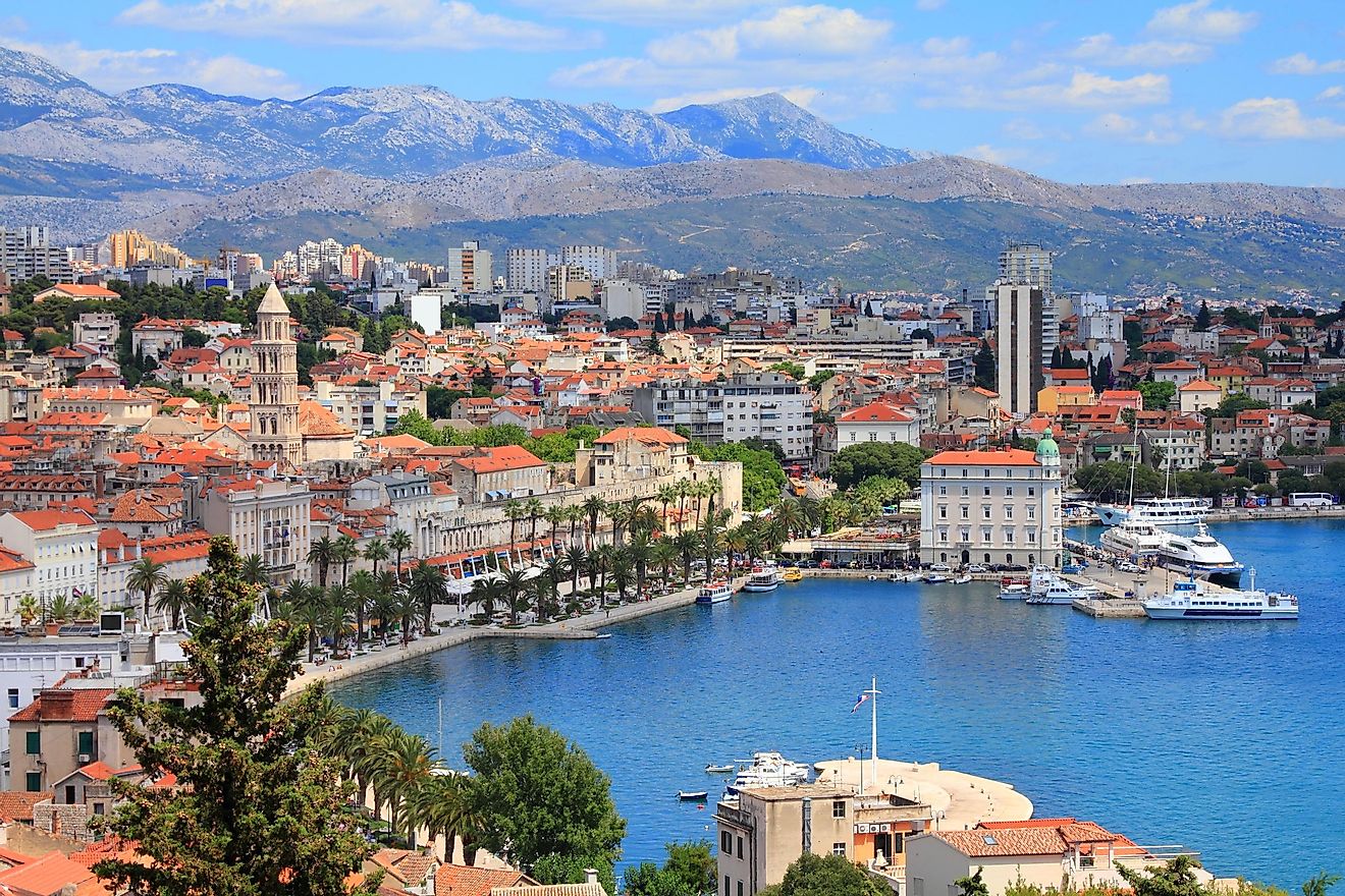 The stately Old Town facade of Split, Croatia, backdropped by the Dinaric Alps and met by the Adriatic Sea.