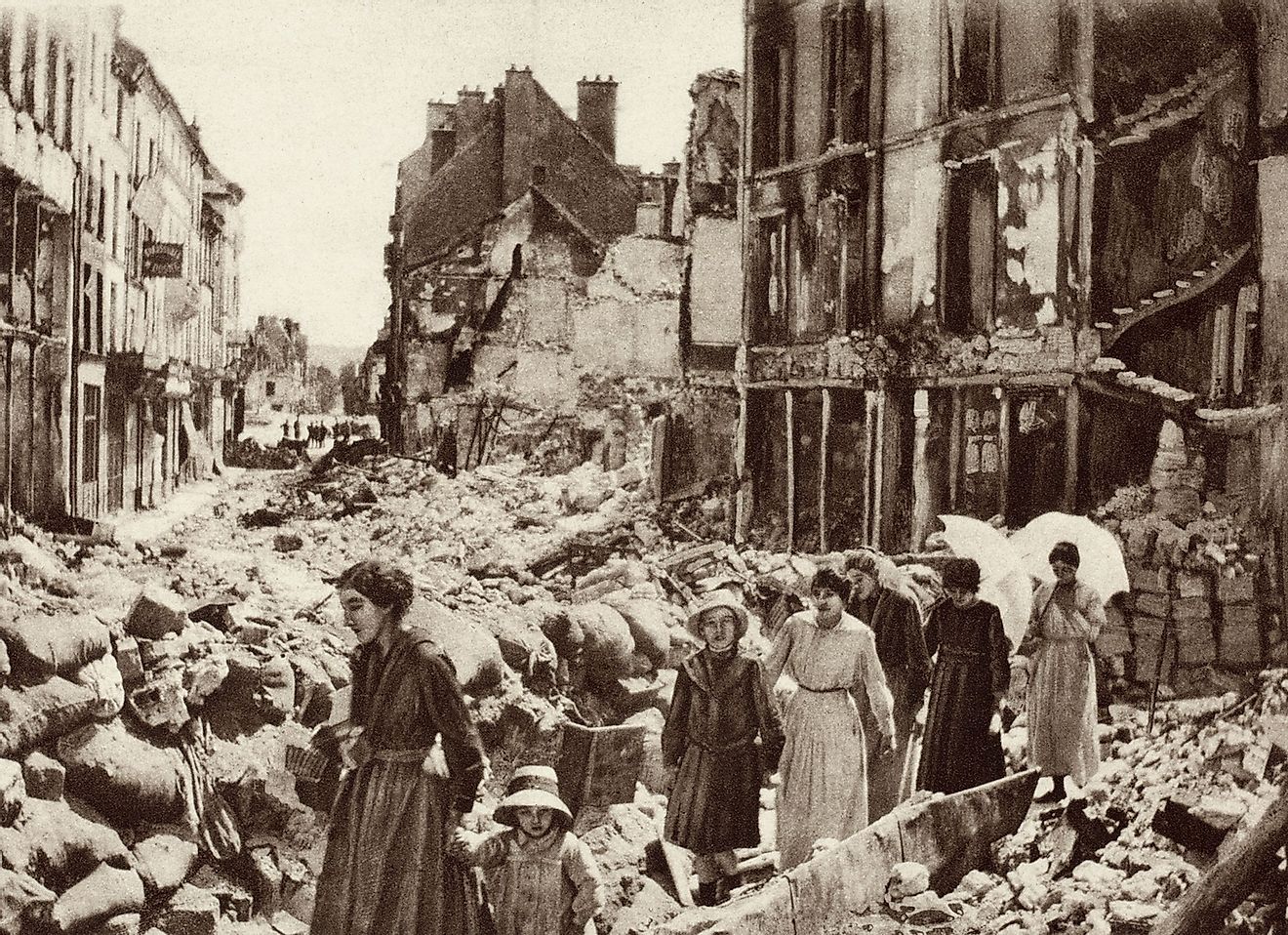 World War 1. Women and children who had been hiding in the cellars of Chateau-Thierry, France, emerging after the Allies liberated the city in July 1918. Image source: Everett Collection/Shutterstock.com