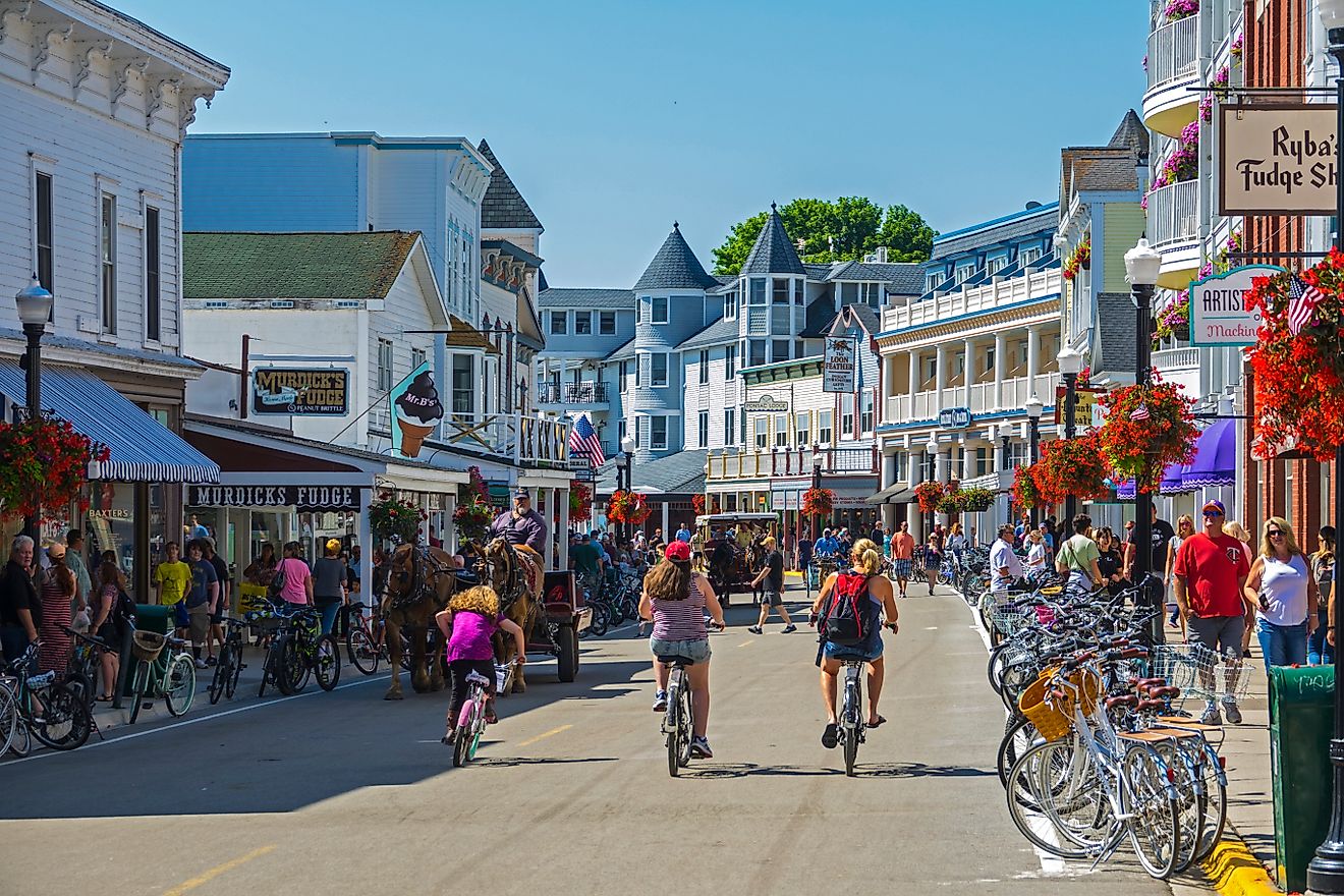People at the downtown area of Mackinac Island, Michigan, to enjoy its many attractions.