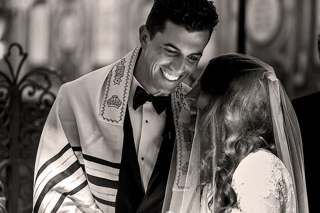 A bride and groom at a traditional Jewish wedding. 