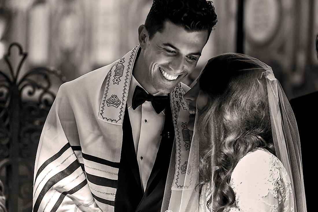 A bride and groom at a traditional Jewish wedding. 