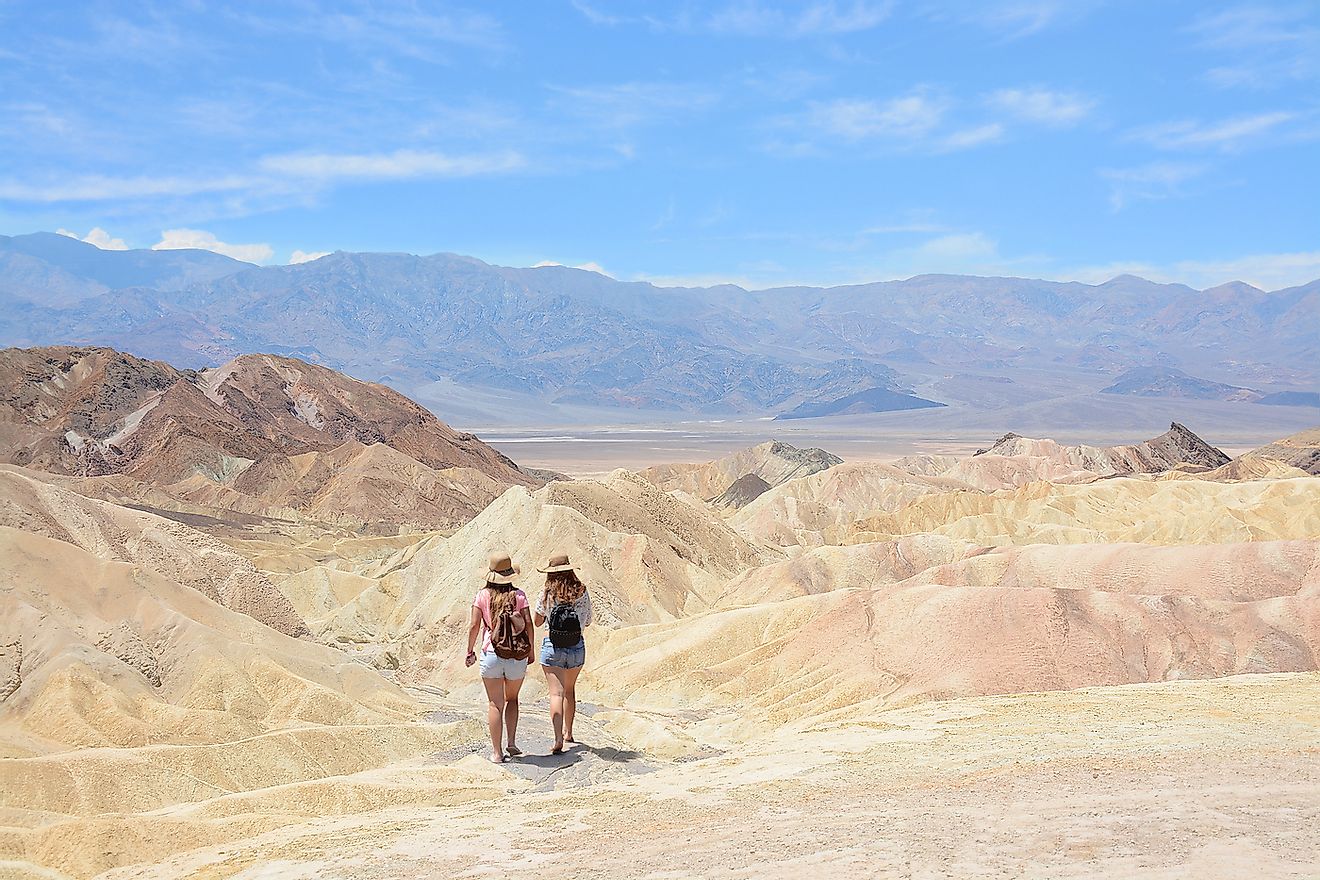 Friends hiking in the mountains on vacation trip. Death Valley National Park landscape , eastern California and Nevada, USA. Image credit: Margaret.wiktor/Shutterstock.com