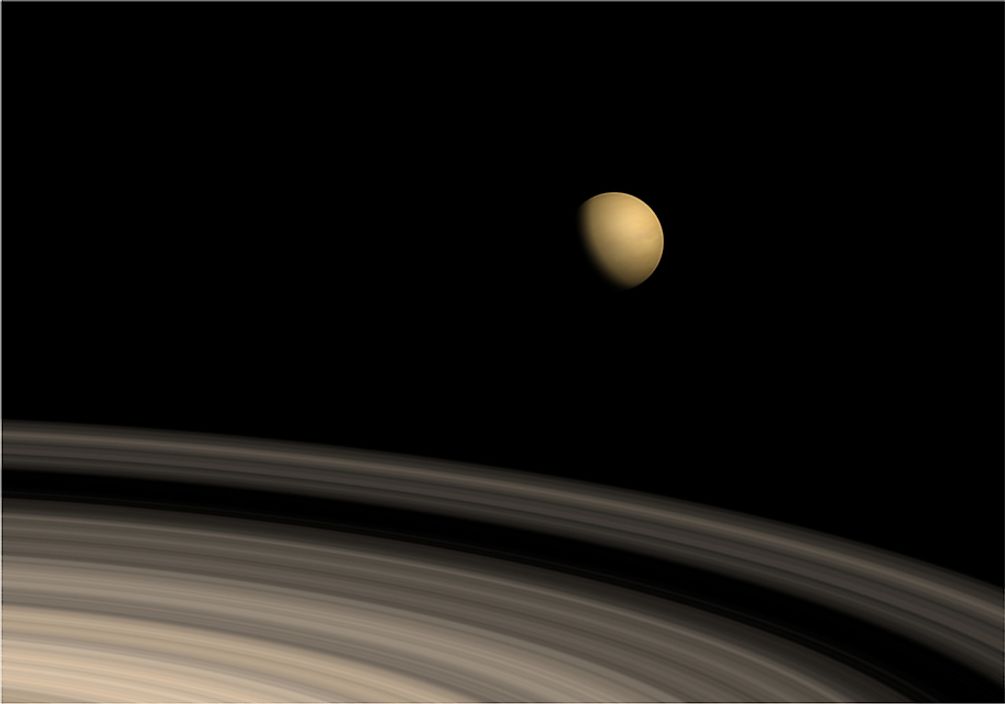 Saturn's largest moon, Titan, is shown orbiting the planet.