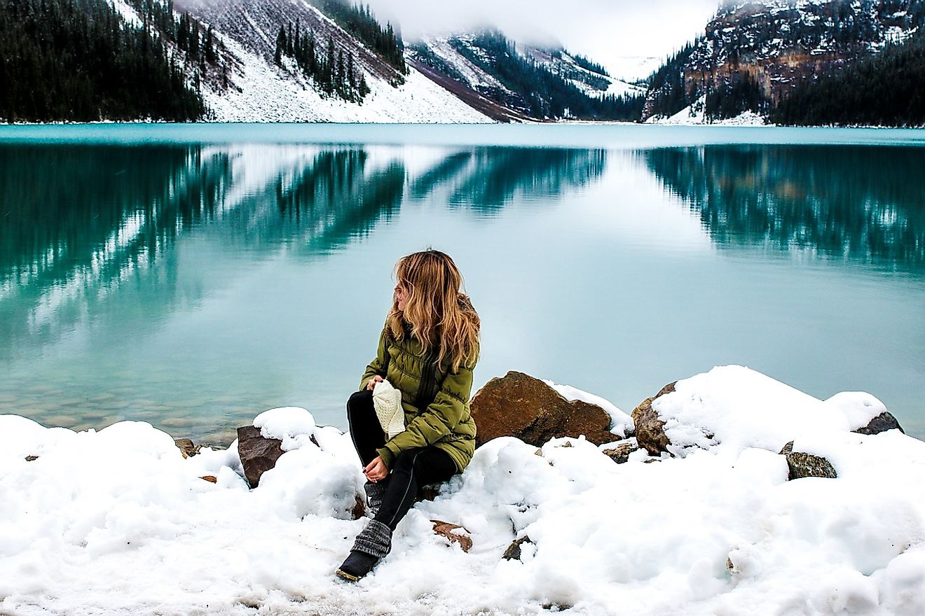 A woman staring into the beauty of Lake Louise. Image credit: Olya Adamovich from Pixabay