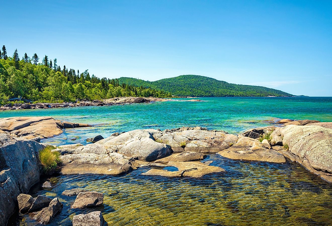 Trees, rocks, forest and Lake on the Under the Volcano Trail along the beautiful rocky coast of Lake Superior at Neys Provincial Park, Ontario, Canada