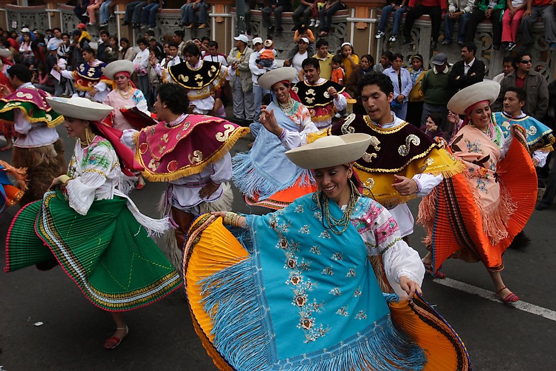 Ecuadorian dancers perform in a carnival in Riobamba, Ecuador. Editorial credit: nouseforname / Shutterstock.com.