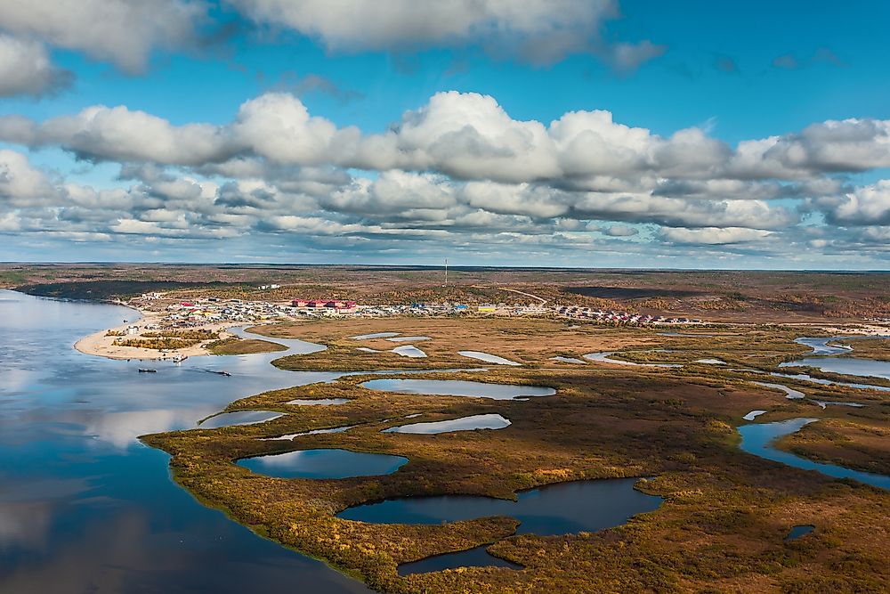 Thermokarst occurs when permafrost melts. Pictured here is melting permafrost in Russia.