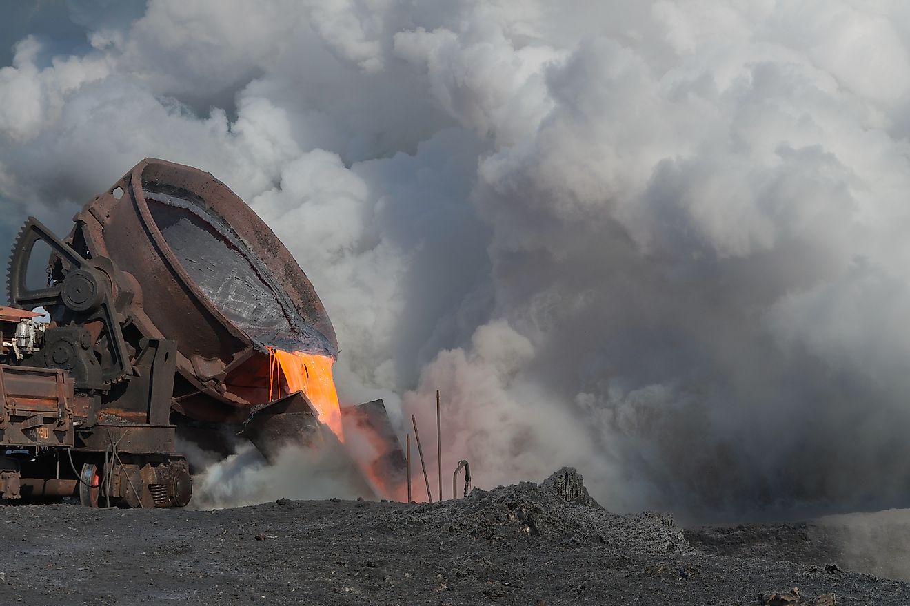 The liquid molten slag and a cloud of hot steam generated during the granulation of the slag polluting the land. Image credit: Nordroden/Shutterstock.com