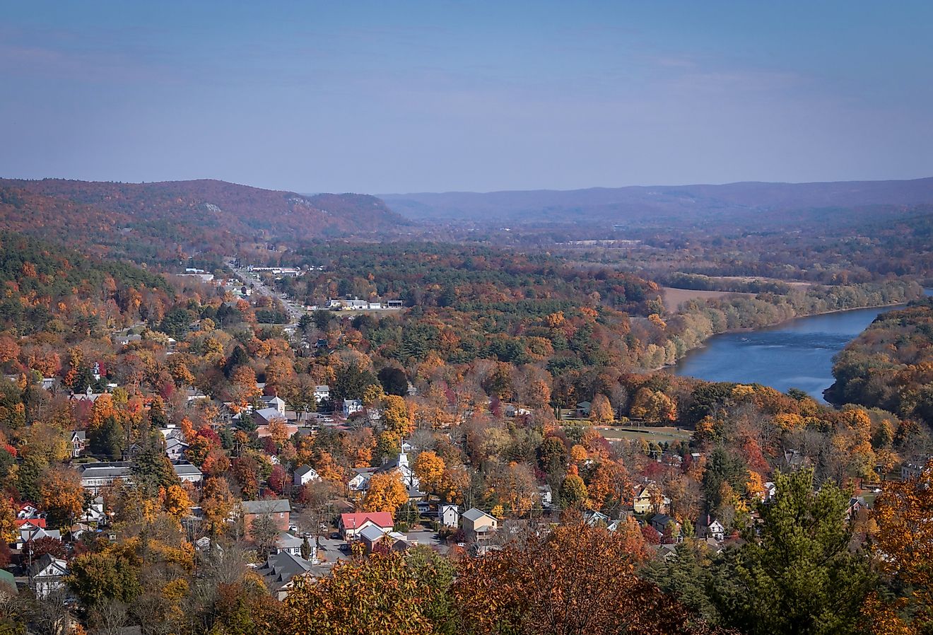 Aerial view of Milford, Pennsylvania, and the Delaware River from a scenic overlook on a sunny fall day.