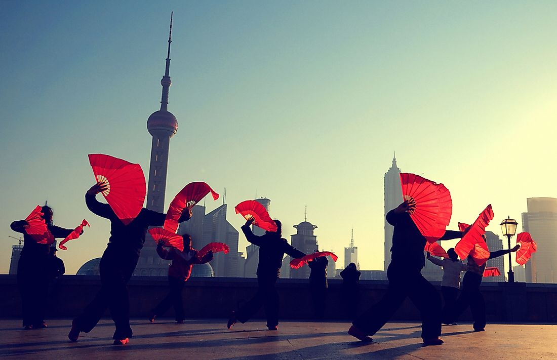 Women performing traditional dances in Shanghai. Many aspects of Chinese culture combine both old and new.