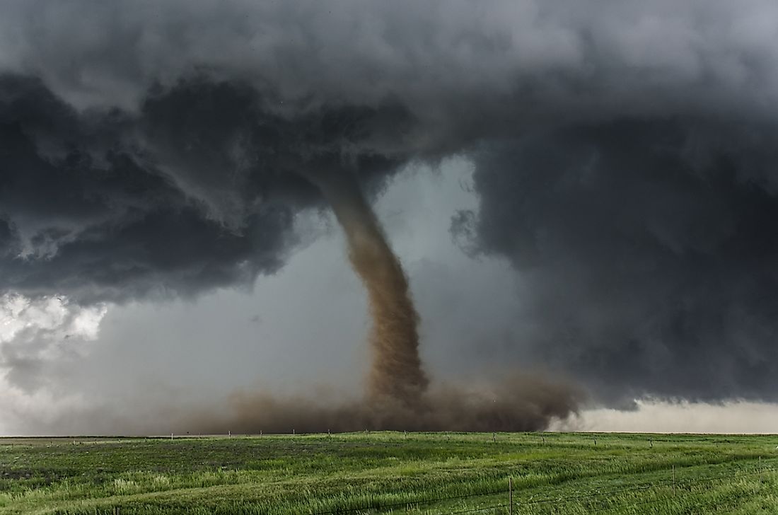 A tornado over a flat field. 