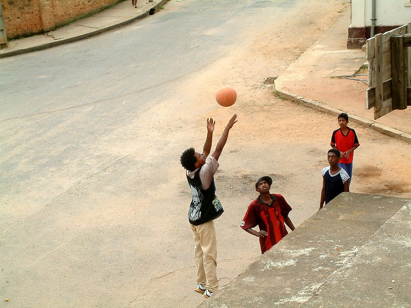 Boys practicing basketball in the street in Madagascar. Image credit: Muriel Lasure/Shutterstock.com