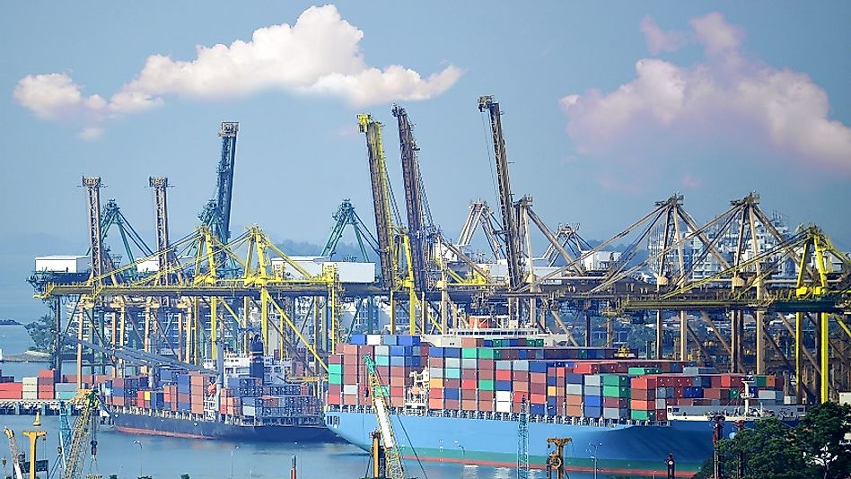 Ships being loaded in Hong Kong Harbor to transport exports all around the globe.