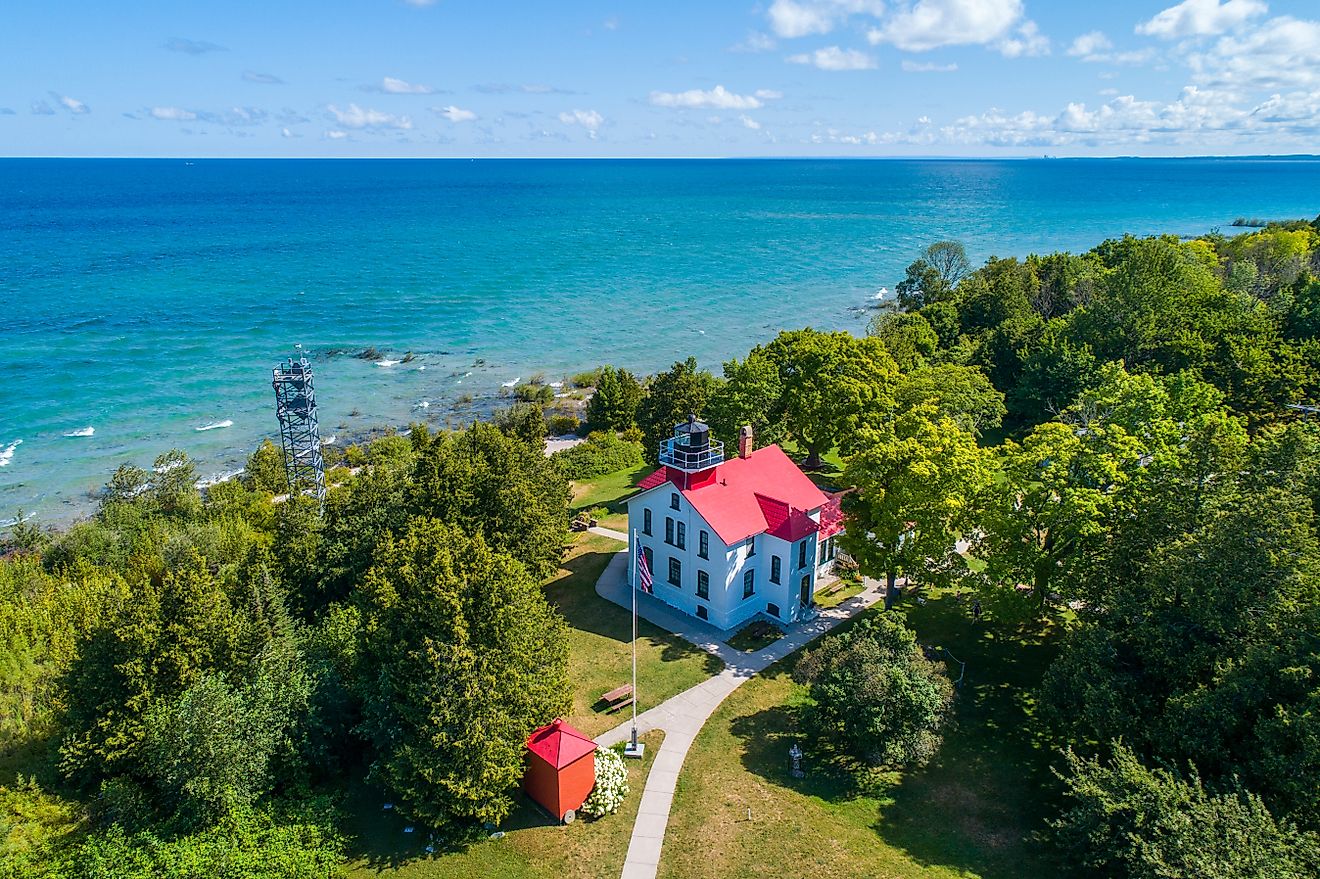 Grand Traverse Light at the tip of the Leelanau Peninsula, Michigan, which separates Lake Michigan and Grand Traverse Bay. (Editorial credit: Dennis MacDonald / Shutterstock.com)