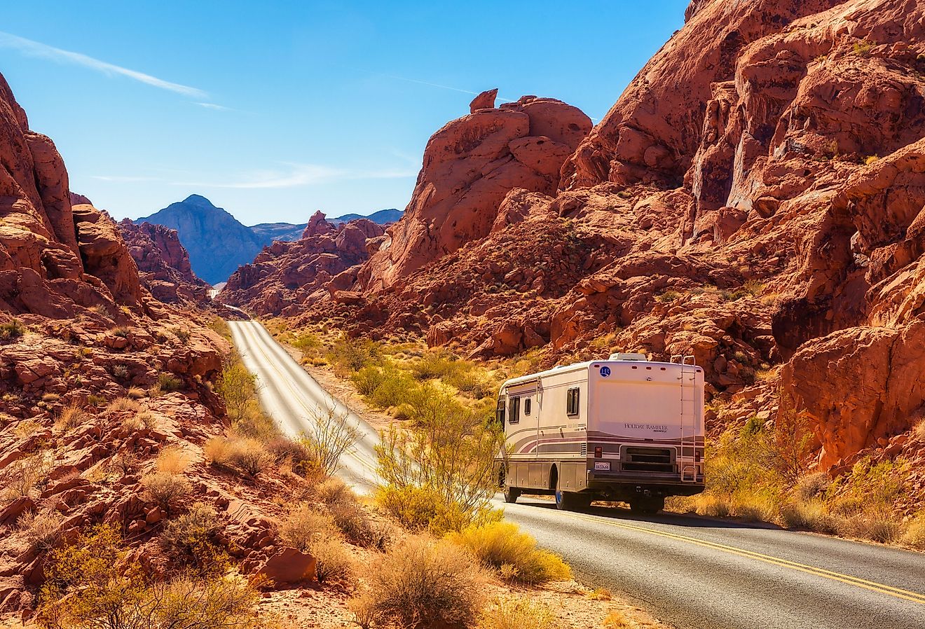 Motorhome trailer traveling on the road in Valley of Fire in Nevada. Image credit Nick Fox via Shutterstock.