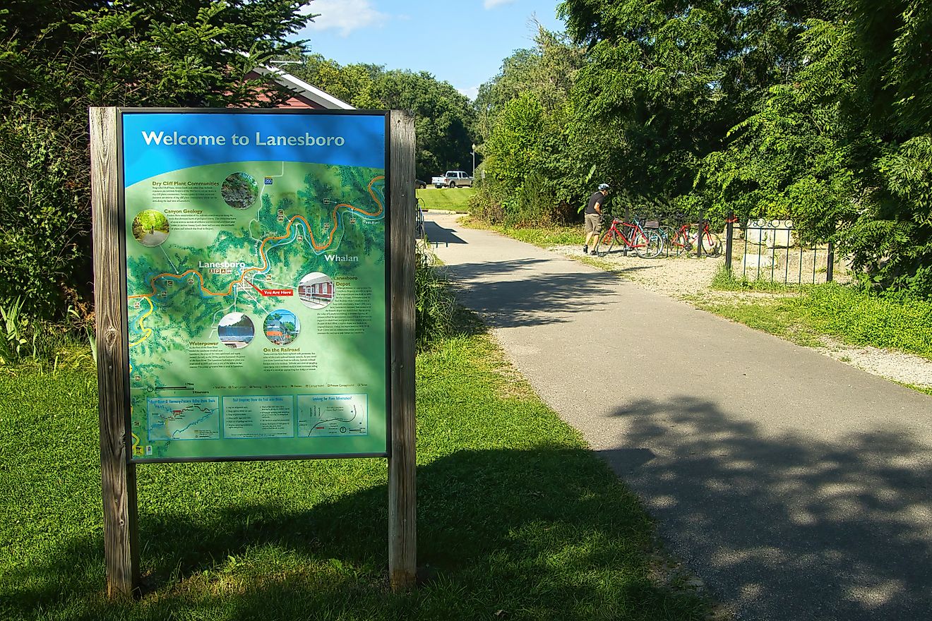 A Welcome to Lanesboro sign along the Root River Trail in Lanesboro, Minnesota. Editorial credit: Dave Jonasen / Shutterstock.com.