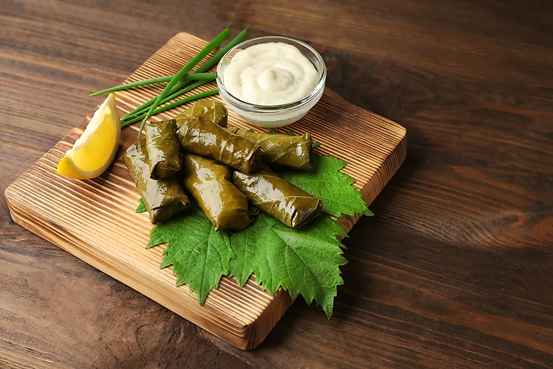 Stuffed dolma with lemon sauce.