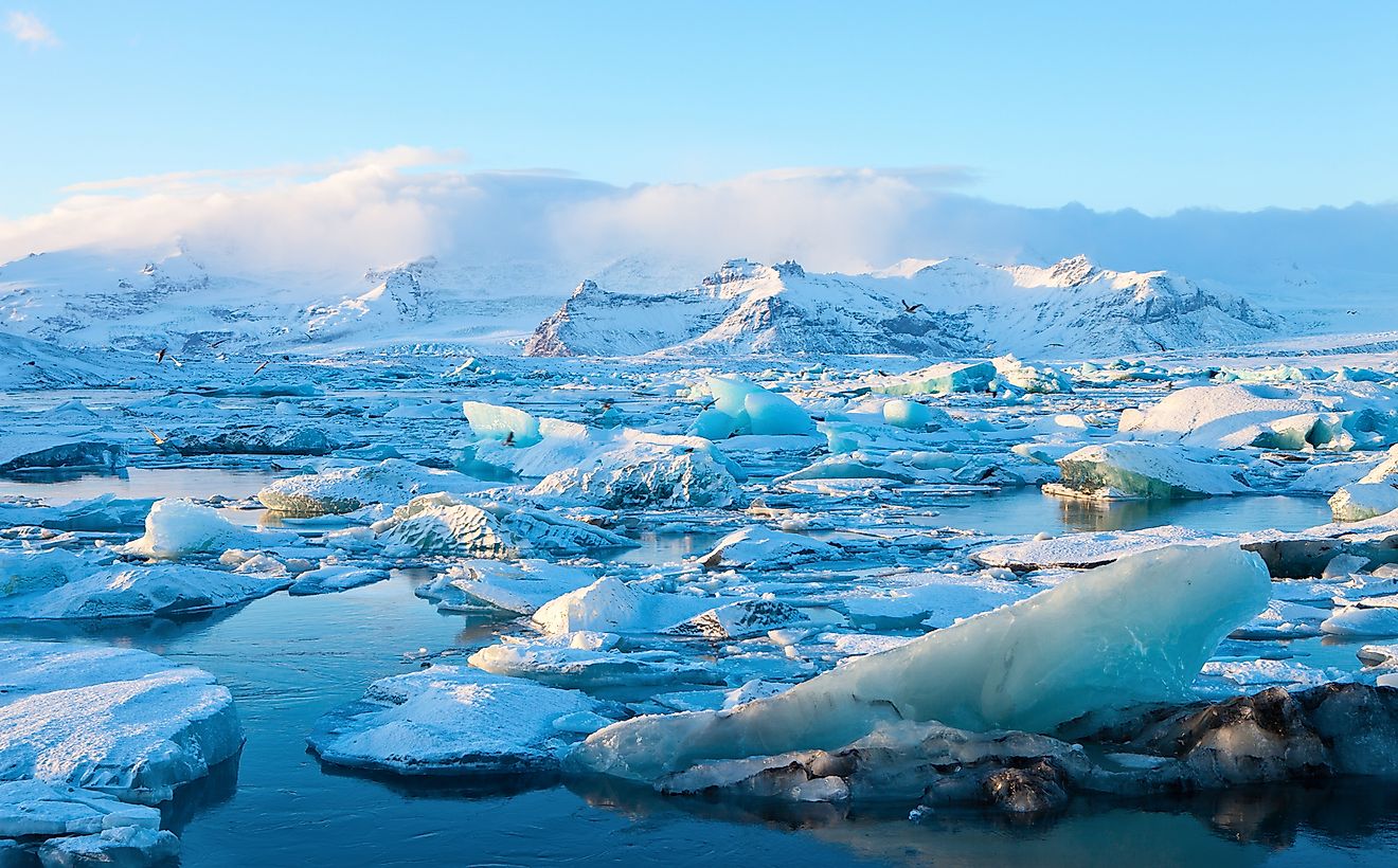 Icebergs in Jokulsarlon Glacier Lagoon with Vatnajokull in the background, south Iceland.