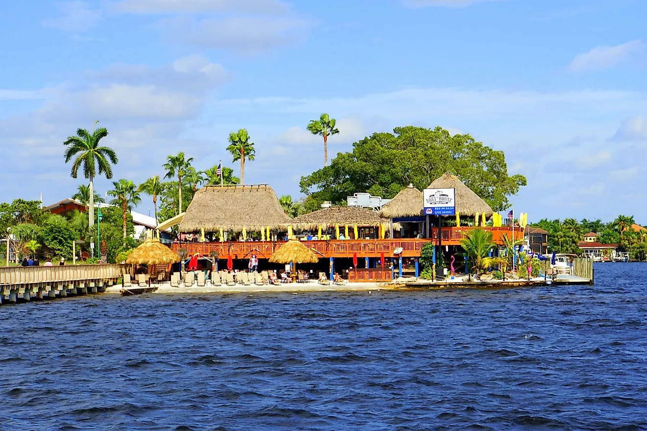 The view of Boat House Tiki Bar and Grill by the bay in Cape Coral, Florida. Editorial credit: Khairil Azhar Junos / Shutterstock.com