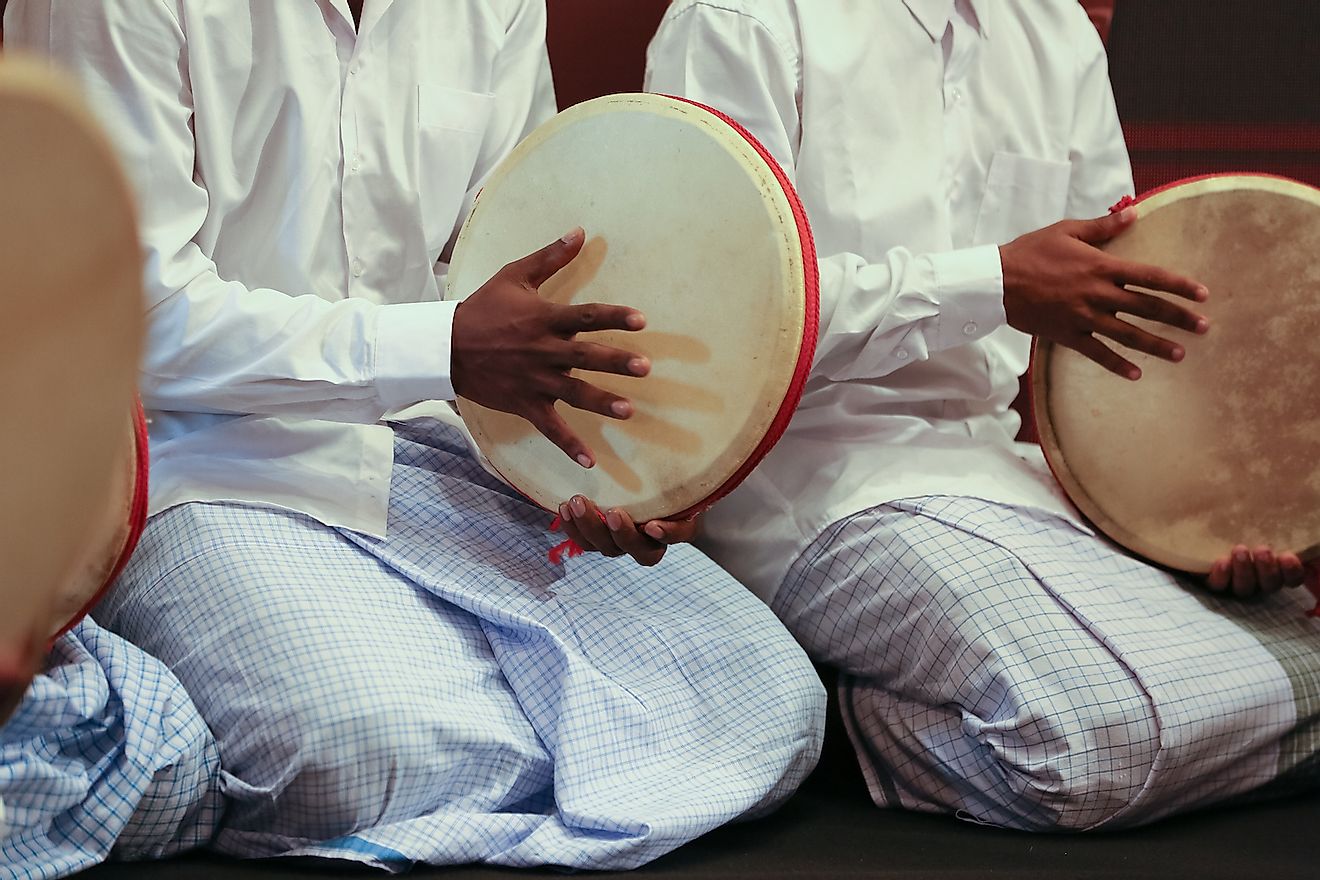 Musicians playing the traditional musical instrument of Maldives. Image credit: 22August/Shutterstock.com