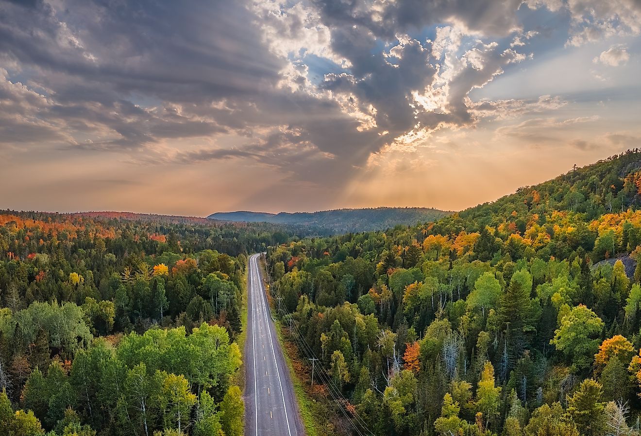 Sunset autumn drive through the tunnel of trees in Michigan's Upper Peninsula.