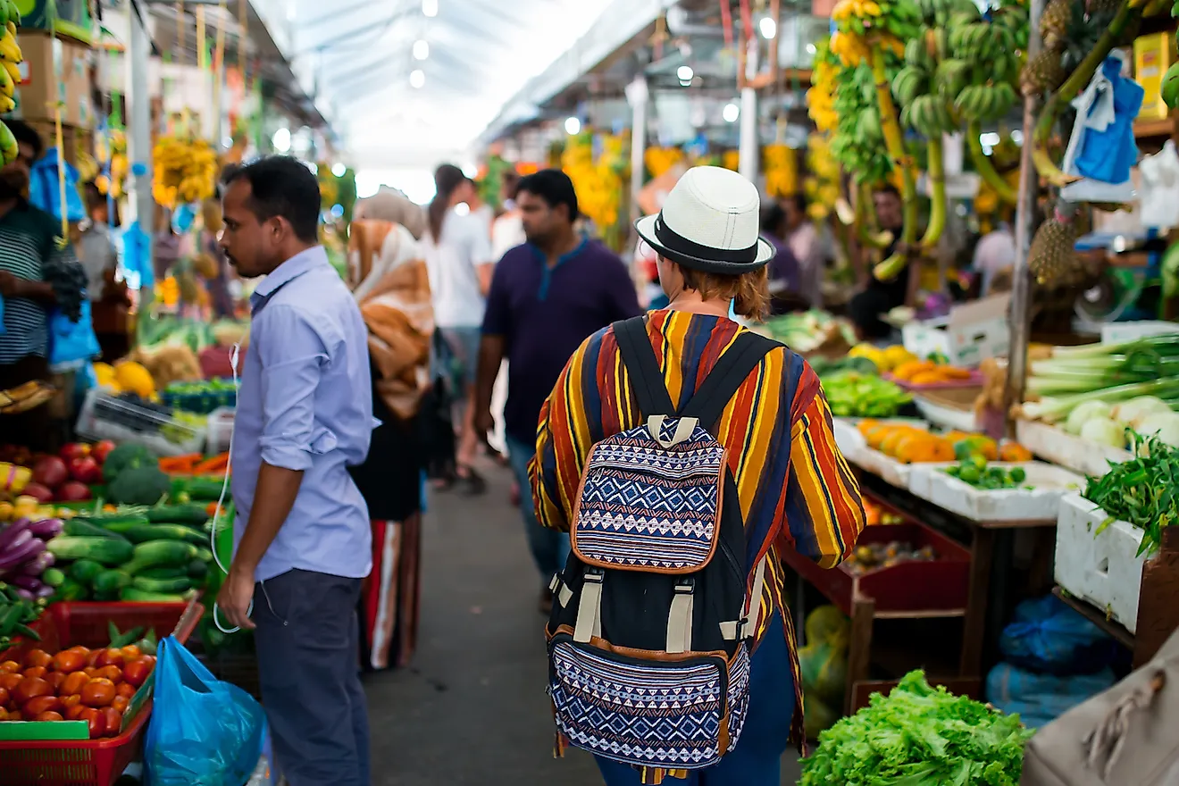 A tourist observing the locals and their way of life in Male, Maldives. Image credit: Ivan Kurmyshov/Shutterstock.com