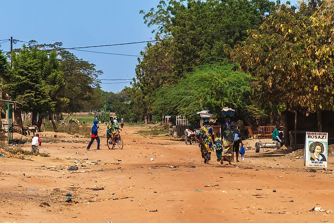 Women and men walking in Ouagadougou, Burkina Faso. Editorial credit: MattLphotography / Shutterstock.com.