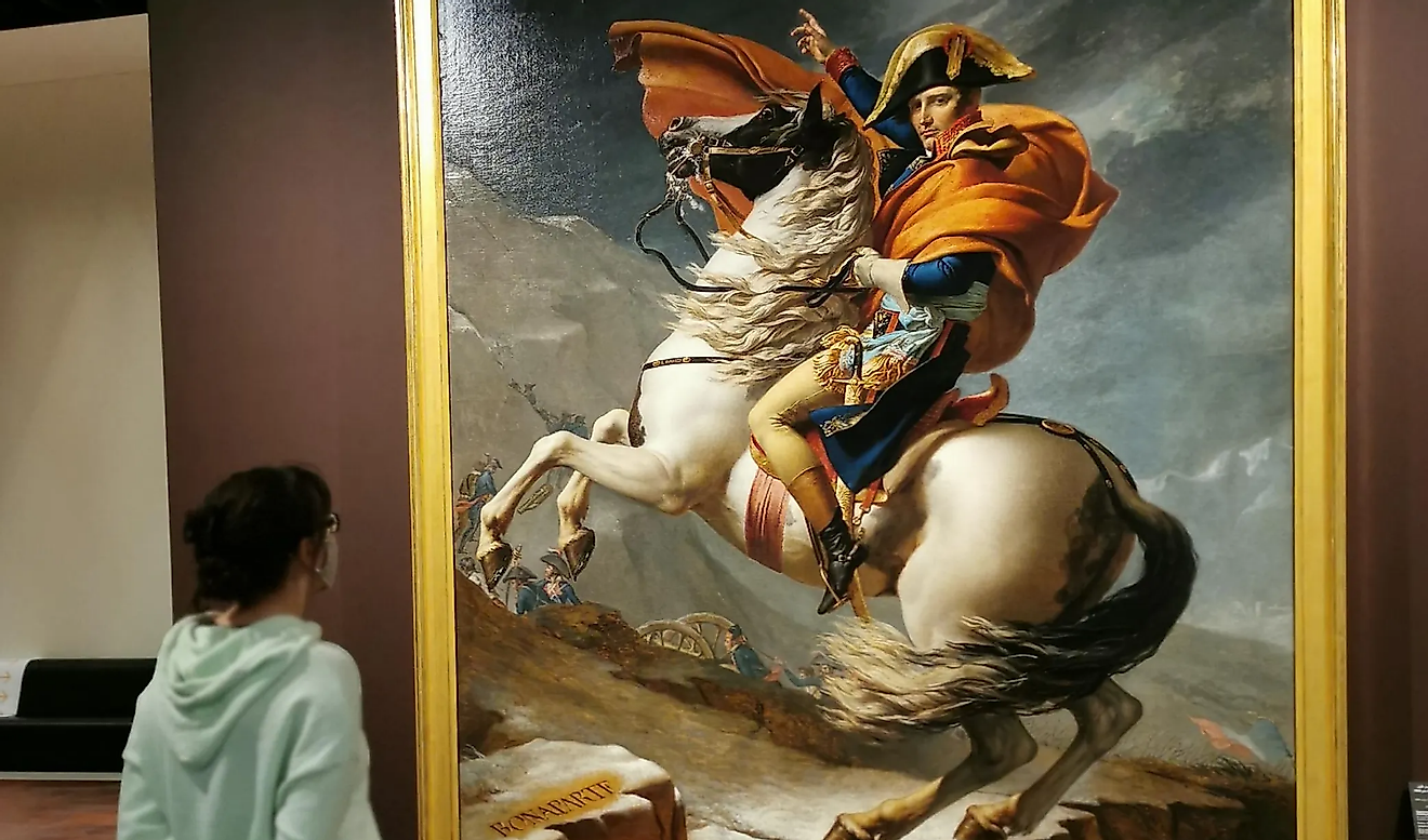 A young girl stands in front of David's famous painting, Napoleon Crossing the Alps. 