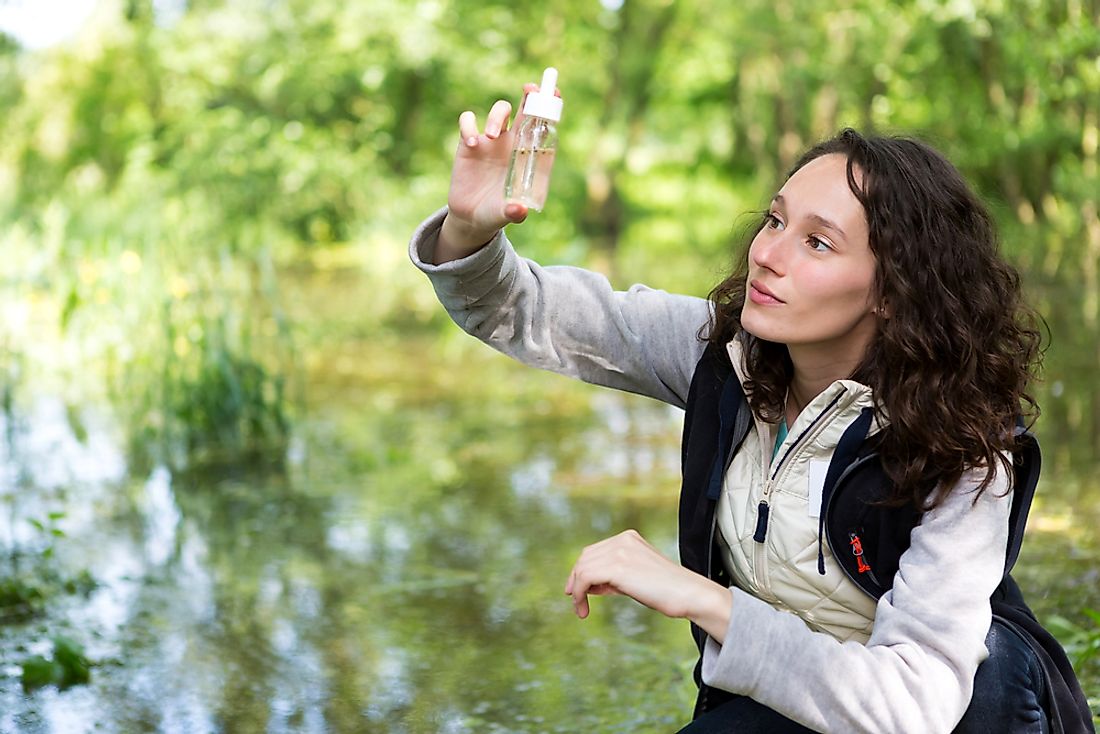 A biologist performing a water analysis. 