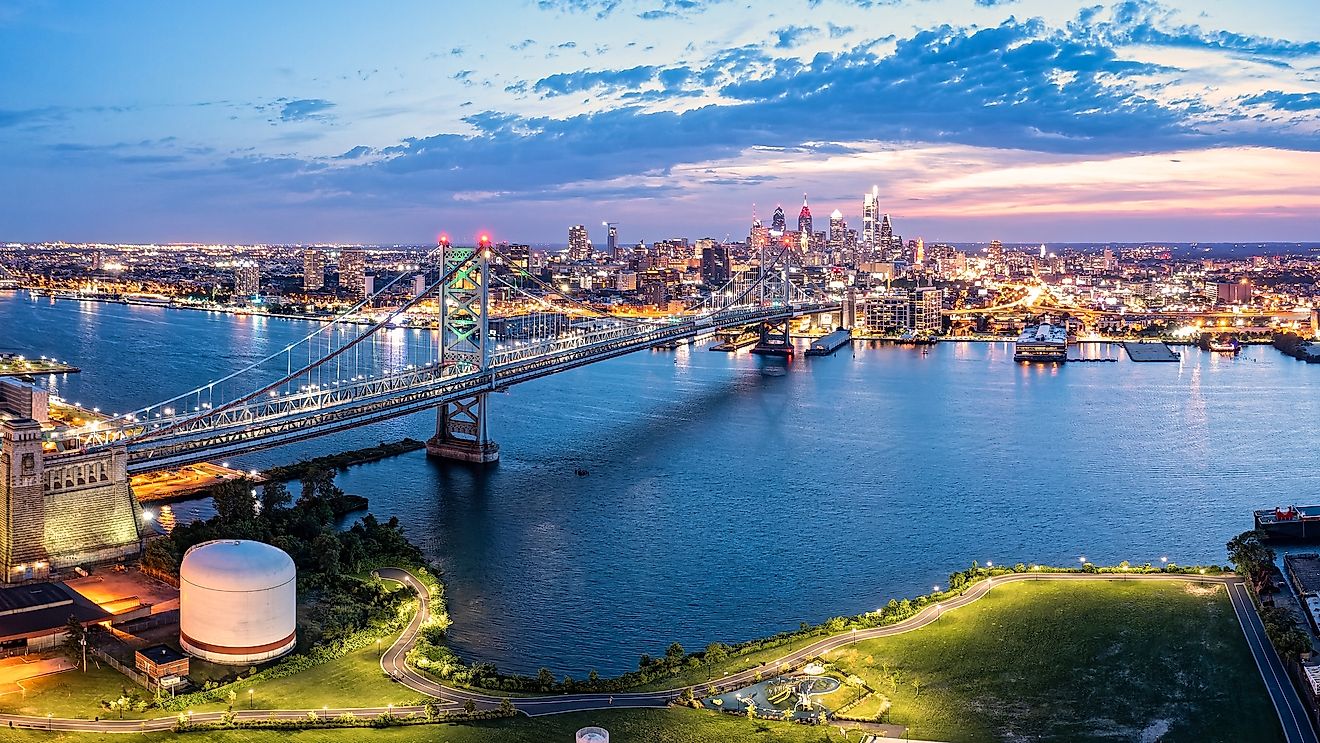 Ben Franklin Bridge and Philadelphia skyline at dusk viewed from above Cooper's Poynt Park, in Camden.