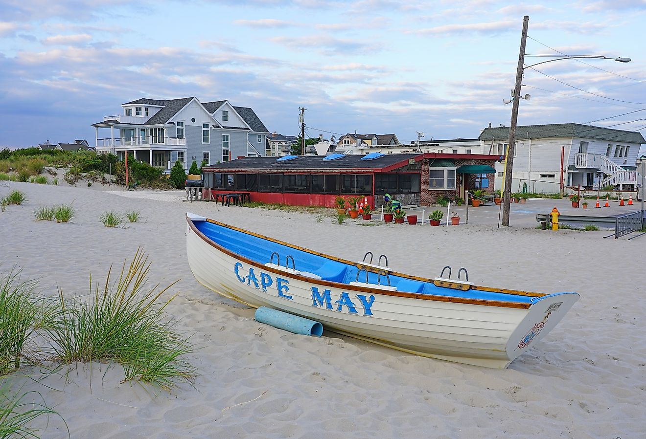 Cape May sign on the beach in Cape May, New Jersey. Image credit EQRoy via Shutterstock