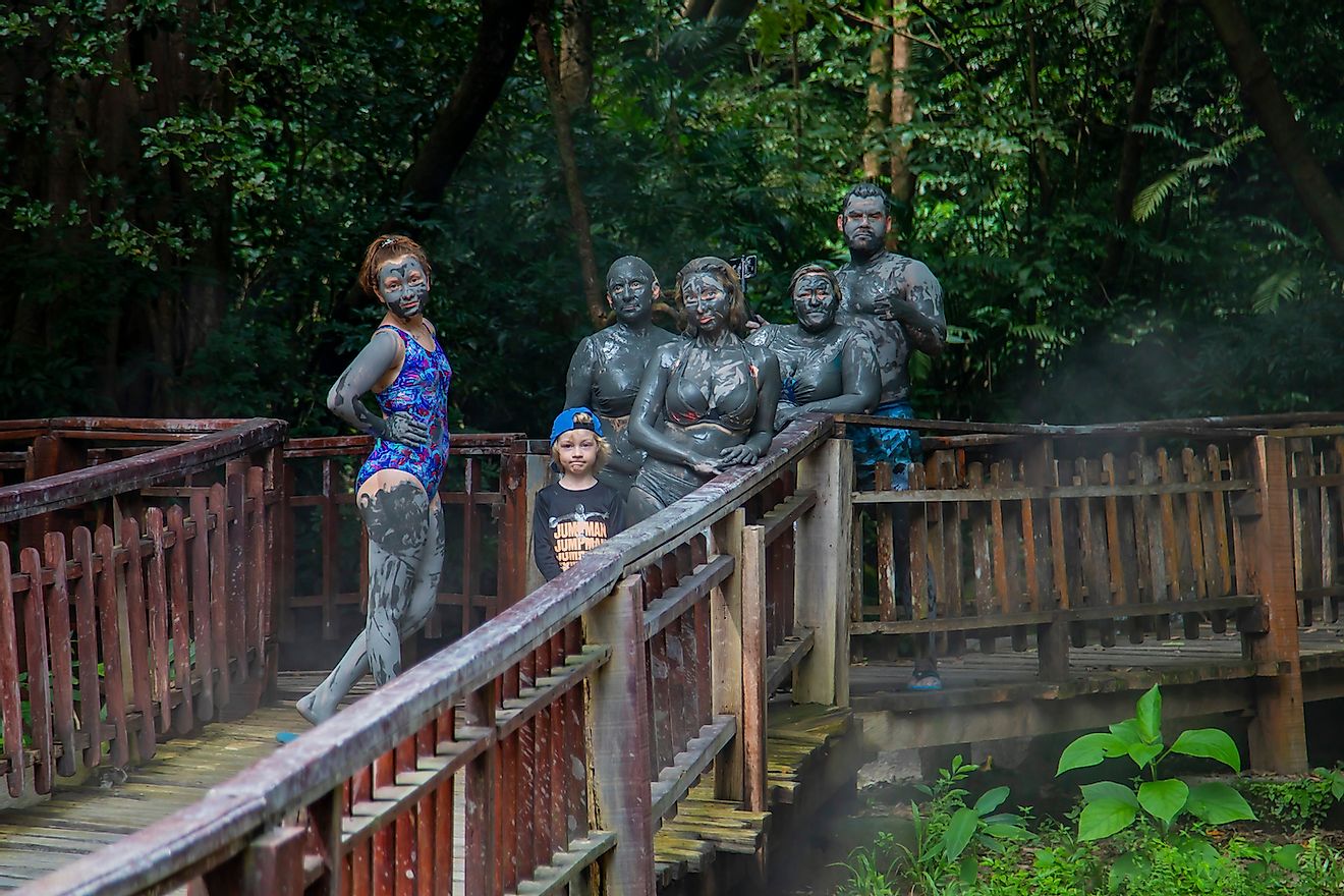 Tourists vacationing in the hot springs on Mount Borinken Costa Rica. Image credit: Xenia_Photography/Shutterstock.com