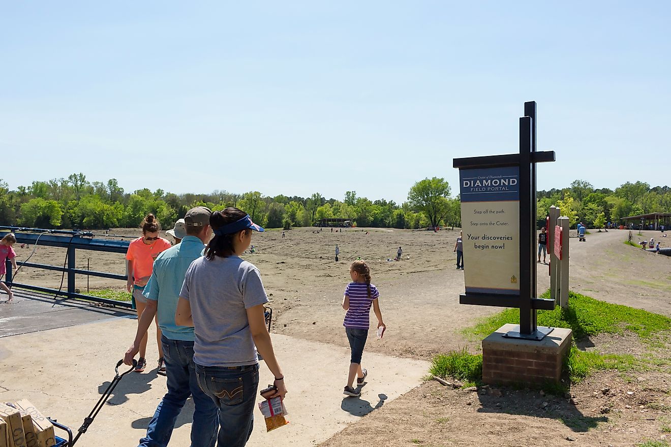 People look for diamonds in the field at Crater of Diamonds State Park in Murfreesboro, Arkansas. Editorial credit: Kimberly Boyles / Shutterstock.com