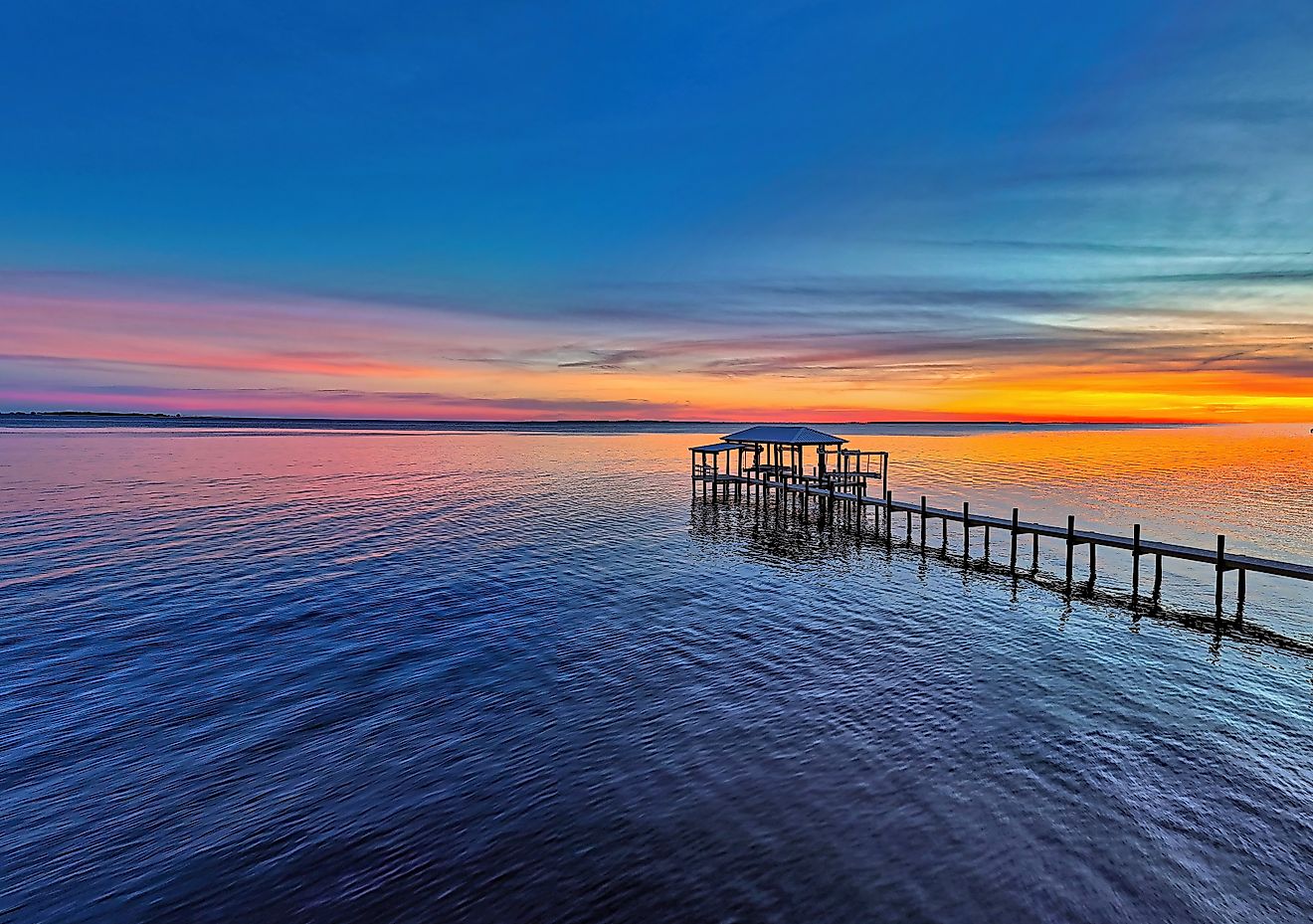 A stunning sunset over Apalachicola Bay in Carrabelle, Florida.